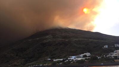 epa07693740 Ash rises into the sky after a volcanic eruption during early morning on the small island of Stromboli, southern Italy. According to reports, the island of Stromboli was hitby a set of violent volcanic eruptions that triggered panic among residents and tourists. Two new lava spouts are reported to creep down the volcano. EPA