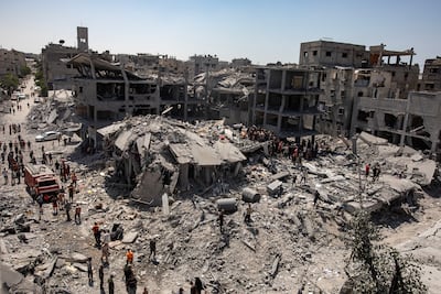 Palestinians search for survivors under the rubble after an Israeli air strike destroyed several homes in Khan Yunis camp in Gaza. EPA