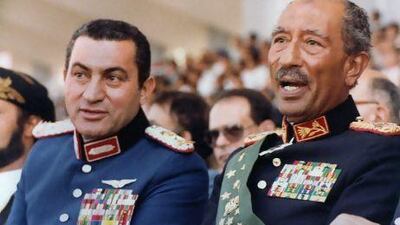 vice President at the time, Hosni Mubarak (left) and late president Anwar Sadat, attend a military parade on October 6, 1981, in Cairo during which the latter was assassinated. AFP Photo
