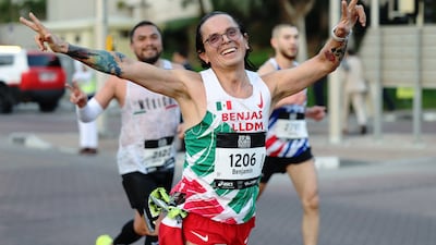 Runners with time for a smile during the Dubai Marathon on February 1