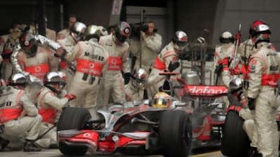 Lewis Hamilton of Britain takes his McLaren Mercedes in for a pitstop during the Chinese Grand Prix at the Shanghai International Circuit on October 19, 2008.