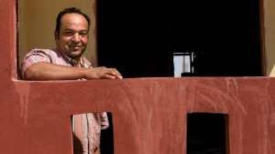 Ashraf Abaz stands in his new home, a three-storey dwelling he is building through the Egyptian government's Ibni Baitak, or "Build your own home", programme.