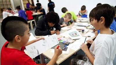 Children take part in a comic drawing workshop at Manarat Al Saadiyat in Abu Dhabi. The workshop's aim was to discover the links that exist between the art in Birth of a Museum and comic strips. Christopher Pike / The National