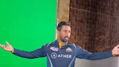 Gujarat Titans player Wriddhiman Saha with the IPL 2023 jersey. @gujarat_titans / Instagram