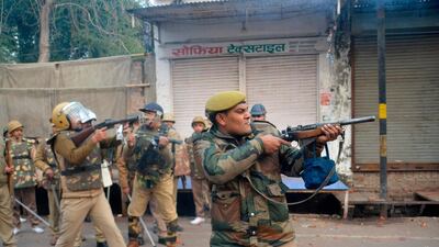 Security personnel fire teargas during demonstrations against India's new citizenship law in Meerut. AFP
