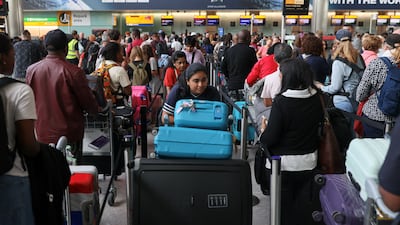 Passengers at Heathrow Airport near London wait for news after a radar system failure led to the suspension of outbound flights across the UK. Reuters