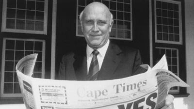 South African President FW de Klerk outside his office in Cape Town, in 1992 with a copy of a local newspaper with a banner headline declaring a 'Yes' result in a referendum vote to end apartheid and share power with the black majority for the first time. AP Photo