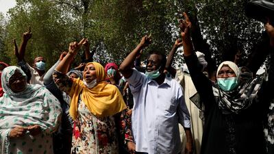Supporters of ousted former Sudanese President Omar al-Bashir shout slogans the moment Omar al-Bashir and his companions arrived at the courtroom in Khartoum, Sudan. EPA