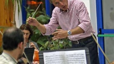Philipp Maier conducts the UAE Philharmonic Orchestra during a recent summer rehearsal session.