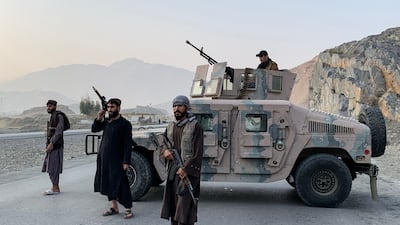 Taliban security personnel stand guard near the Torkham border crossing between Afghanistan and Pakistan in the Nangarhar province. AFP