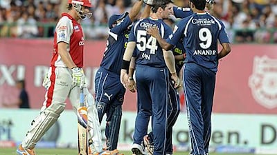 Deccan players congratulate Daniel Christian, centre, who dismissed the Kings XI captain Adam Gilchrist, left, during their 82-run win in the IPL.