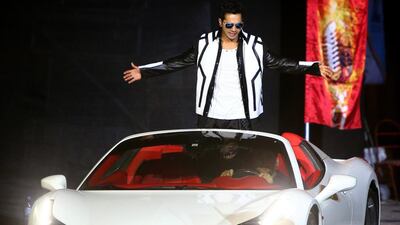 Indian actor and dancer, Varun Dhawan arrives in a Ferrari luxury car. AFP