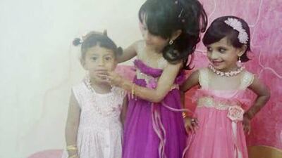 Shahd al Harthi, left, who died last week. On the far right is her sister Reem.