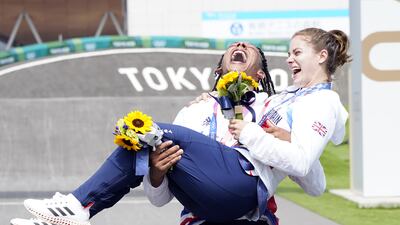 Great Britain's Bethany Shriever and Kye Whyte celebrate their gold and silver medals respectively for the Cycling BMX Racing.