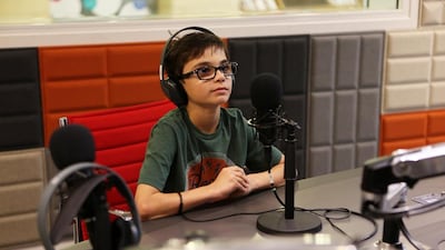 Oscar Mairet, 10, during his radio show at Pearl FM, a station especially for children based at Al Jalila Cultural Centre for Children in Dubai. Pawan Singh / The National