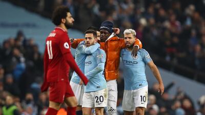 Benjamin Mendy of Manchester City celebrates victory with Sergio Aguero, Bernardo Silva and Ilkay Gundogan. Getty Images