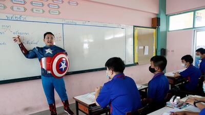 Thai teacher Sattawat Kongsang dressed in cosplay as Captain America teaches in a classroom at Prataungtipvittaya School in Bangkok, Thailand. EPA