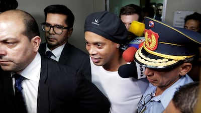 Ronaldinho leaves Paraguay's Supreme Court after testifying. Reuters