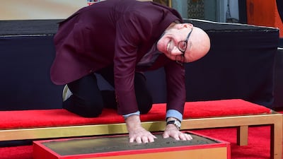 Stewart presses his hands into cement at a ceremony at the TCL Chinese Theatre in Hollywood, California, in 2020. AFP