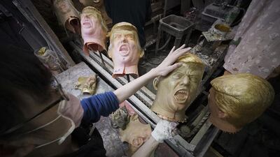 A worker moulds rubber masks depicting President-elect Donald Trump on a production line at the Ogawa Studio in Saitama, north of Tokyo. AP