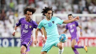 Al Ain's Mohammed Abdulrahman, left, and Al Hilal's Matias Britos during the first leg of their Asian Champions League quarter-final at Hazza bin Zayed Stadium. Chris Whiteoak / The National