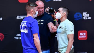 Tim Elliott and Ryan Benoit face off during the UFC Fight Night weigh-in on Tuesday.