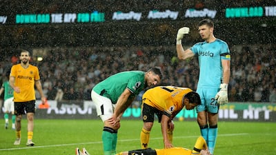 Wolverhampton Wanderers' Pedro Neto lies on the pitch after pulling his hamstring. PA