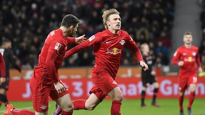 RB Leipzig’s Emil Forsberg, centre, celebrates his goal during the German Bundesliga football match against Bayer Leverkusen on November 18, 2016. RB Leipzig won the match with 3-2. Martin Meissner / AP Photo