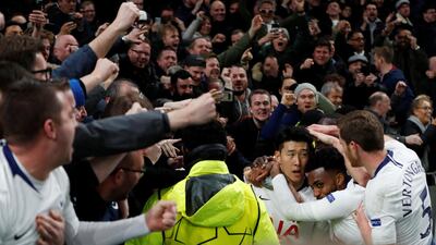 Tottenham's Son Heung-min celebrates scoring their first goal with team mates and fans. Reuters
