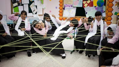 Sixth Grade students play a game at their first English lesson of the year at the Queeba Girls School in Ras Al Khaimah. Razan Alzayani / The National