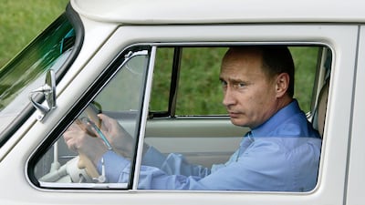 Putin takes a ride in his 1956 "Volga" as he attends an opening ceremony of Adler-Krasnaya Polyana tunnel in Krasnodar region on August 19, 2005. AFP