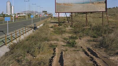 A photo from the Imported Landscape series by Corinne Silva displayed on a billboard in Spain. Courtesy Corinne Silva and The Mosaic Rooms