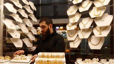 A salesman arranges gold bracelets inside a jewellery shop in Beirut, Lebanon. REUTERS