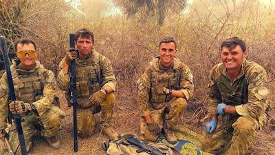British peacekeepers pose with an AK47 rifle found in an operation against ISIS-linked militants operating in Mali. Ministry of Defence