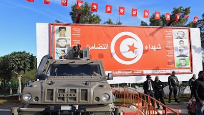 Tunisian special forces stand guard in the impoverished Tunis district of Ettadhamen on January 14, 2018 as Tunisians gathered in the streets to mark seven years since the uprising that toppled the Ben Ali regime. Fethi Belaid / AFP
