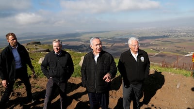 With Israeli Prime Minister Benjamin Netanyahu and US ambassador to Israel David Friedman, in the border region between Israel and Syria, in the Israeli-occupied Golan Heights, in 2019. Reuters