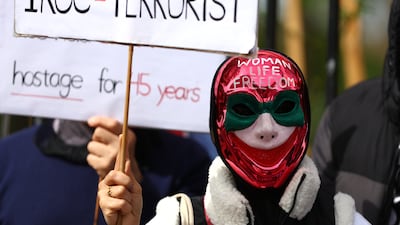 A protester in front of the Iranian Embassy in London on Sunday. Getty Images