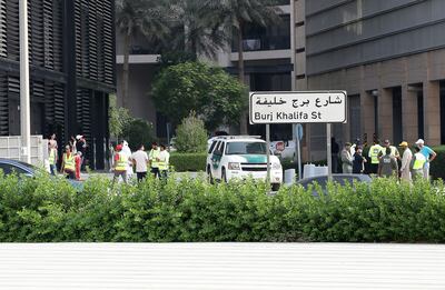 Police and Civil Defence personals at the 8 Boulevard Walk tower where fire broke out early Monday morning at the downtown in Dubai. Pawan Singh / The National