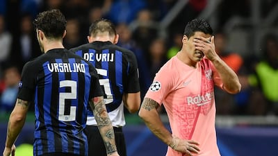 Barcelona's Luis Suarez, right, reacts during the match. AFP