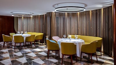 The space features features sleek interiors with marble flooring and wood-panelled walls. Courtesy Queens Grill
