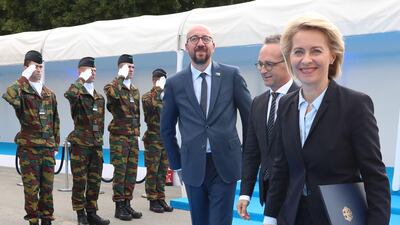 Belgium's Prime Minister Charles Michel (L) greets German Minister of Defence Ursula von der Leyen (R) as she arrives for a working dinner at The Parc du Cinquantenaire — Jubelpark Park in Brussels on July 11, 2018, during the Nato summit. AFP