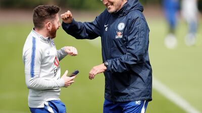 Chelsea manager Maurizio Sarri shares a joke during training. Reuters