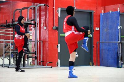 Fahima Falaknaz and Hanan Al Zyodi warm up ahead of a training session. Pawan Singh / The National
