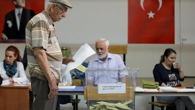 A man casts his ballot for Turkey's presidential and parliamentary elections at a polling station in Ankara, Turkey, on June 24, 2018. Stoyan Nenov / Reuters