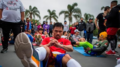 Manny Pacquiao trains in the morning with fans and friends at Pan Pacific Park in Los Angeles. AFP