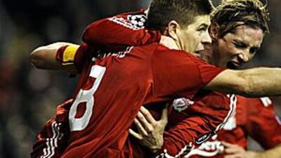 The Liverpool captain Steven Gerrard, left, celebrates with a delighted Fernando Torres after his penalty to make it to 2-0 against Real Madrid.