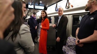 The royal couple on an Elizabeth Line carriage. AP