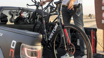 Omar unloads his bikes in the Dubai desert