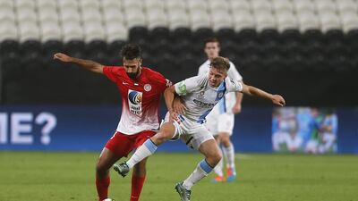Mirko Vucinic, left, of Al Jazira and Jacob Melling of Melbourne City jostle for the ball during their friendly match at Mohammed bin Zayed Stadium in Abu Dhabi on January 11, 2015. Mona Al Marzooqi / The National