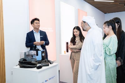 Abbey Wang, centre, at an exhibition of Chinese home appliances. Photo: Abbey Wang
